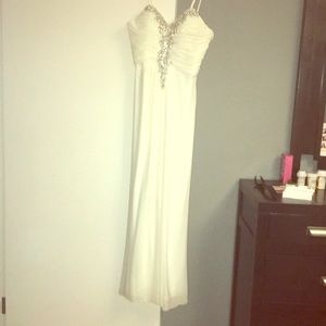 Beautiful white prom dress used one time.